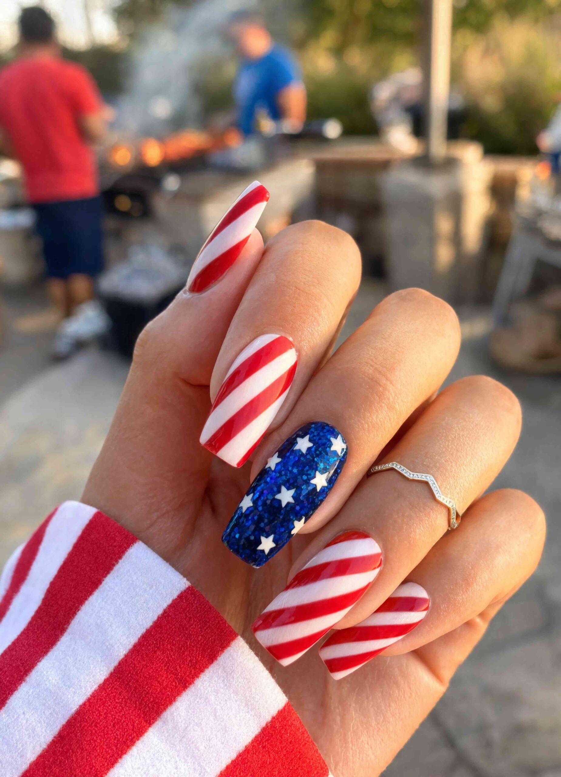 Candy Stripes with a Blue Glitter Star Accent - 4th of July Nail Ideas